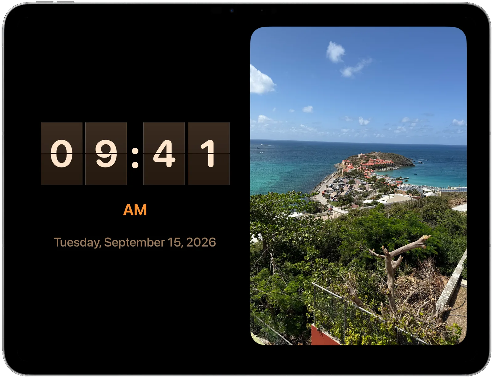 An iPad running Digiframe: a flip clock reading 09:41 with the date Tuesday, September 15, 2026, beside a photo of a Caribbean bay.